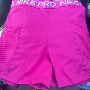 dark pink Nike pros